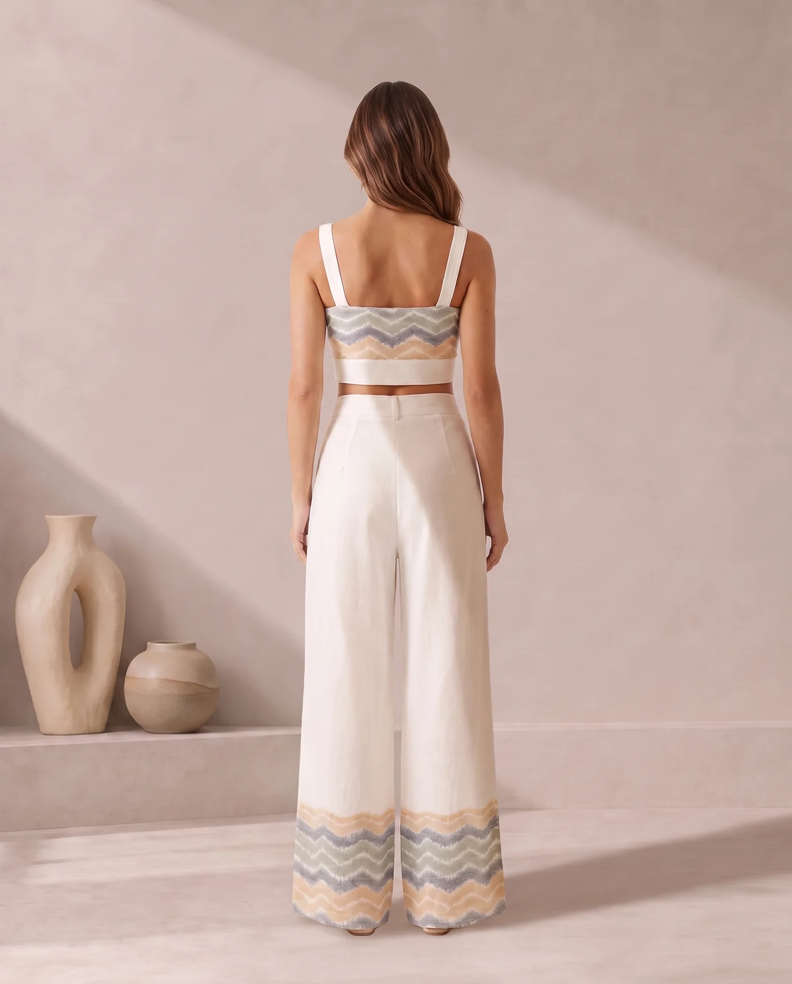 Back view of the ivory bandeau co-ord set with the chevron ikat trouser hem
