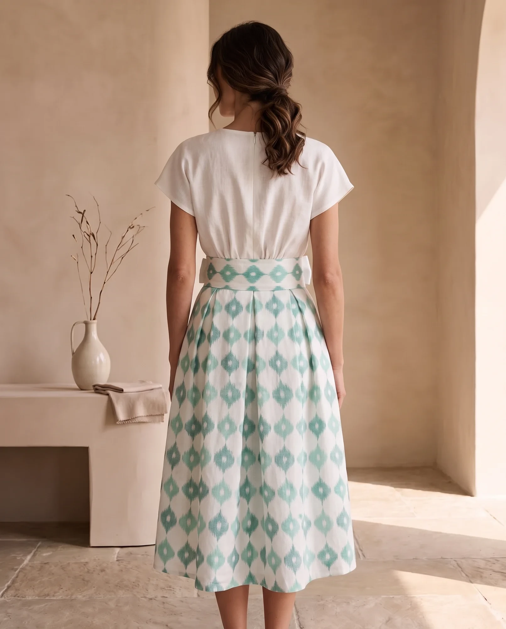 Back view of the high-waisted mint ikat midi skirt